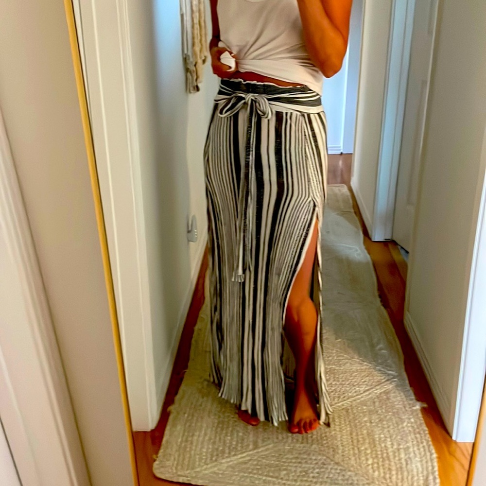 Maxi skirt. Striped with elastic waist, and flattering waist tie. 2 slits.